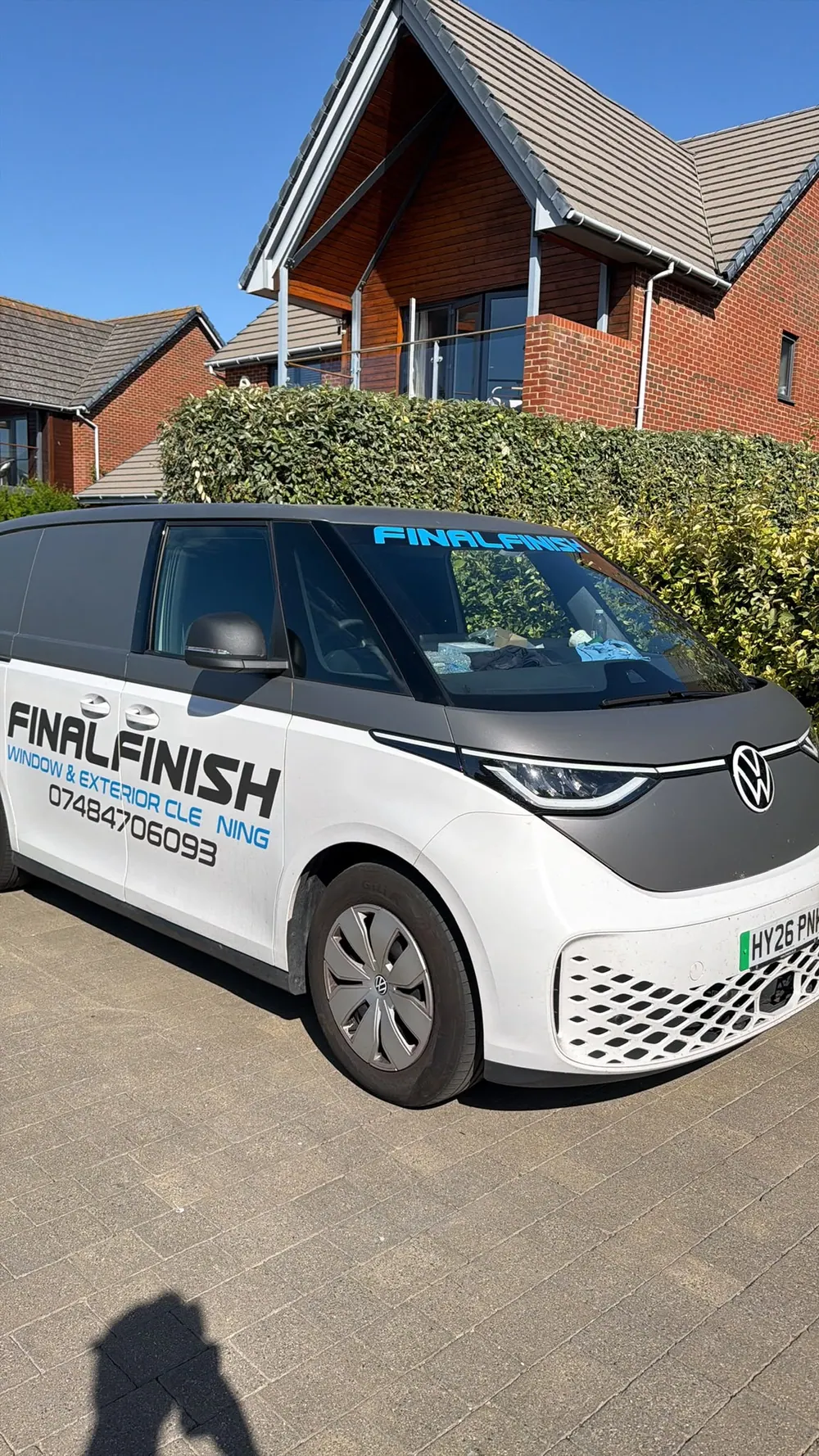 Final Finish van on a block-paved driveway outside a family home